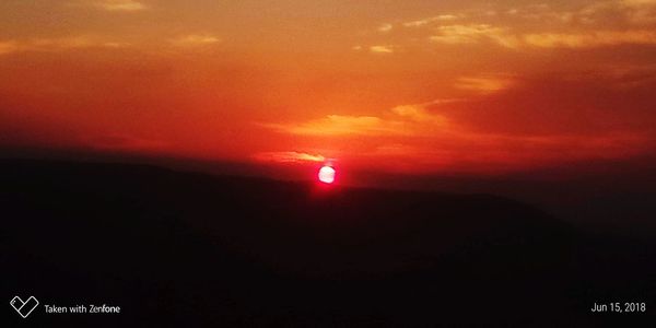 Scenic view of dramatic sky during sunset