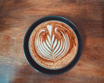 High angle view of cappuccino on table