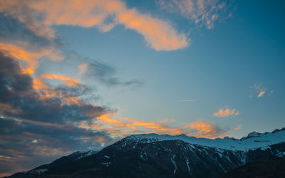 Low angle view of mountains against sky during sunset