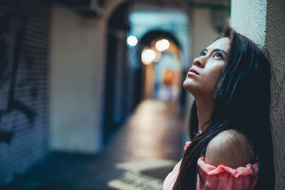 Portrait of young woman looking away