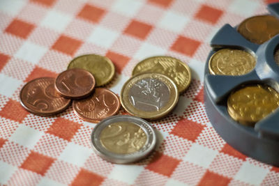 High angle view of coins on table