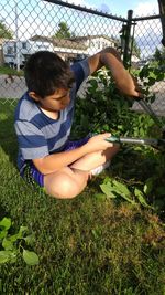 Boy cutting on grass