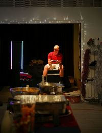 Man sitting on table in restaurant