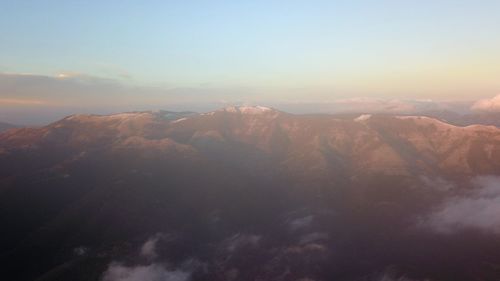 Scenic view of mountains against sky during sunset