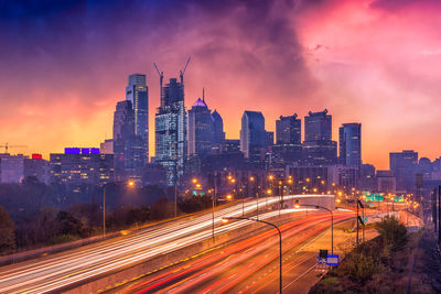 High angle view of light trails on road at sunset