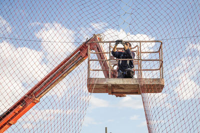 Low angle view of metallic structure against sky