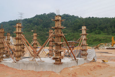 Traditional windmill on field against sky