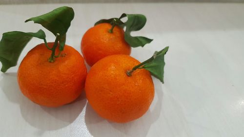 Close-up of orange fruits on table