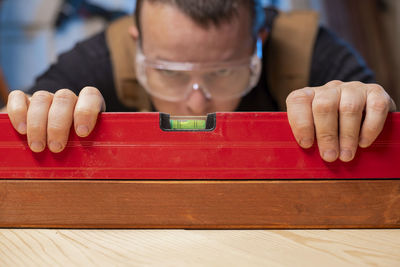 Midsection of man playing with toy blocks