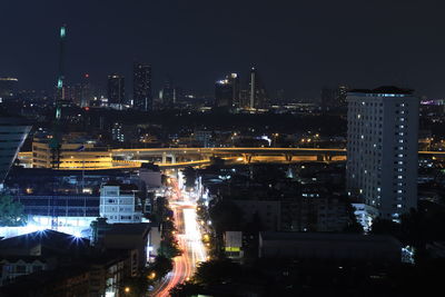 High angle view of illuminated buildings in city at night