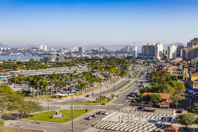 High angle view of city street and buildings against sky