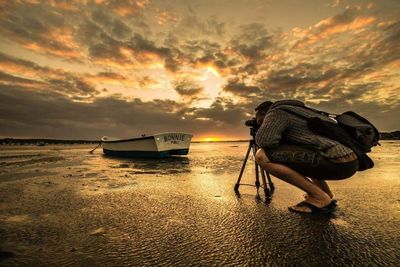 Scenic view of sea against cloudy sky