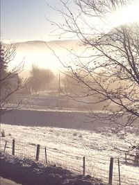 Scenic view of snow covered landscape against sky