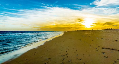 Scenic view of sea at sunset