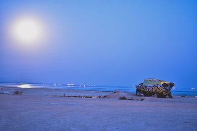 Scenic view of beach against clear blue sky