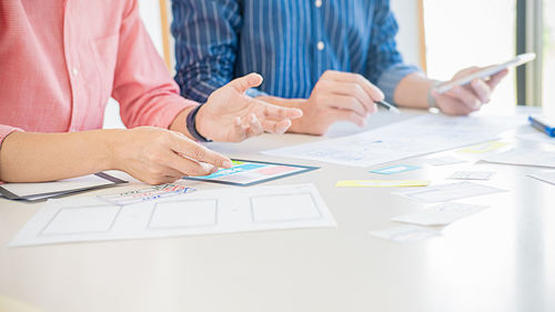 Low section of woman working on table