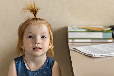 Little girl in the doctor's office. waiting for a pediatrician examination before vaccination.