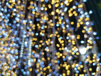 Defocused image of illuminated lights at night, bokeh background