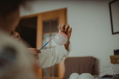 Woman holding christmas decoration