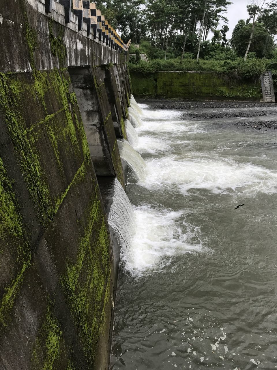 SCENIC VIEW OF RIVER FLOWING AMIDST DAM