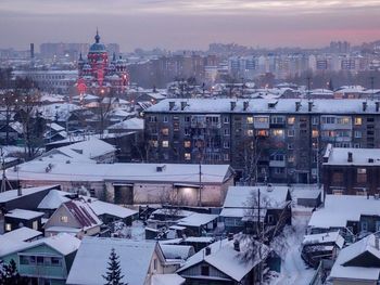 High angle view of buildings in city during winter