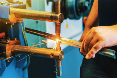 Close-up of man working at factory