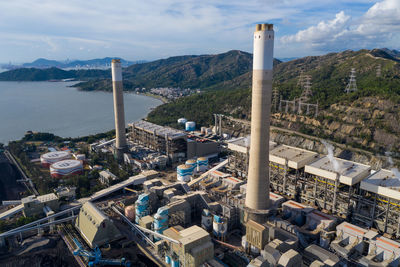 High angle view of buildings and mountains against sky