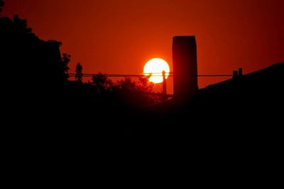 Scenic view of silhouette landscape at sunset