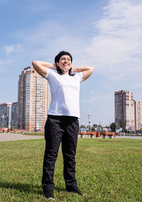 Full length of man standing on field against sky