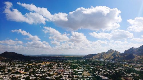 Aerial view of townscape against sky