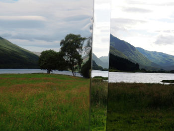 Scenic view of field and mountains against sky