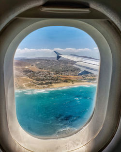 View of sea seen through airplane window