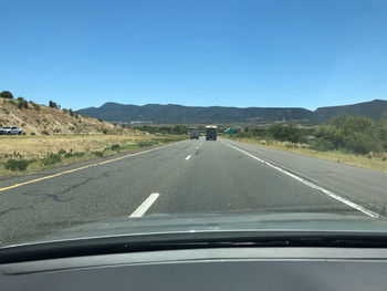 Road seen through car windshield