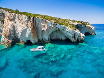 Panoramic view of sea against clear blue sky