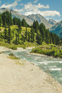 Scenic view of mountains against cloudy sky