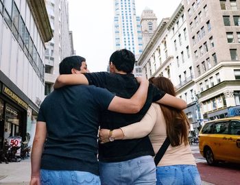 Woman friends on street in city