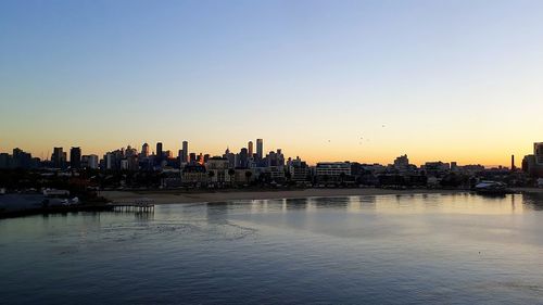 Panoramic view of buildings against sky during sunset