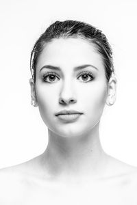 Portrait of a beautiful young woman over white background