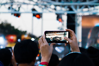 Woman photographing with mobile phone