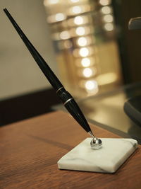 Close-up of pen on table