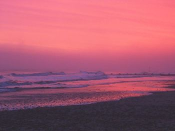 Scenic view of sea at sunset