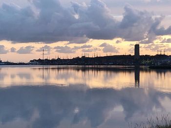 Reflection of sky on water in city