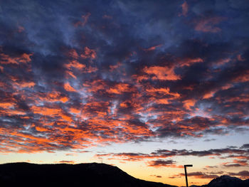 Low angle view of dramatic sky during sunset