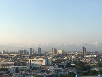 Aerial view of modern buildings in city against sky