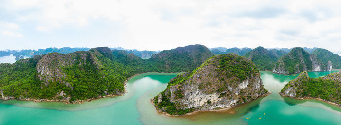 Panoramic view of sea and mountains against sky