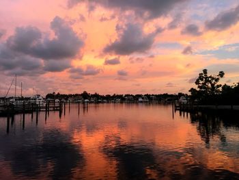 Scenic view of lake against orange sky