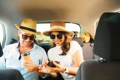 Friends sitting in car