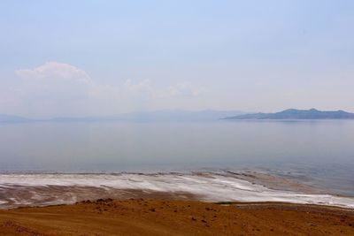 Shore of antelope island against clear sky