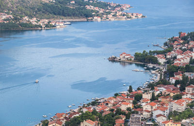 High angle view of townscape by sea