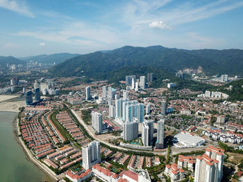 High angle view of buildings in city against sky